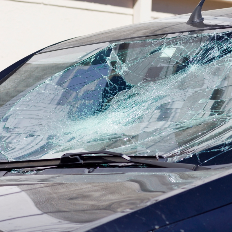 Cracked and shattered windshield on a car, illustrating auto glass damage that Core Collision Kyle - Buda - Georgetown locations repairs and replaces.