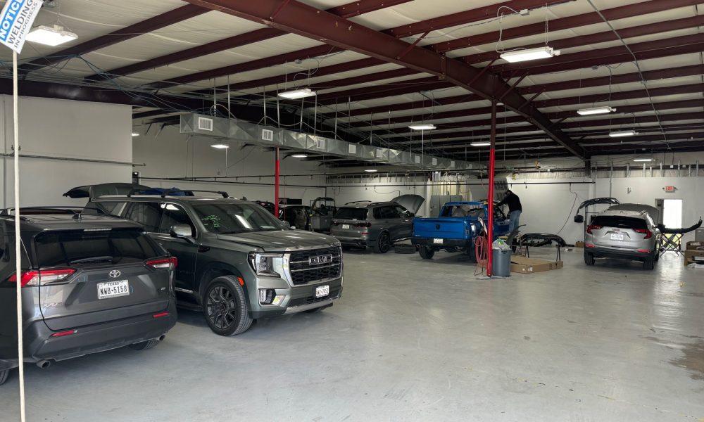Core Collision Georgetown repair shop with multiple vehicles in progress, including frame, body, and paint preparations in Georgetown service facility.